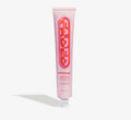 Dark spot serum from Topicals Faded shown as a tall pink 50ml tube with bold red branding on a white background.